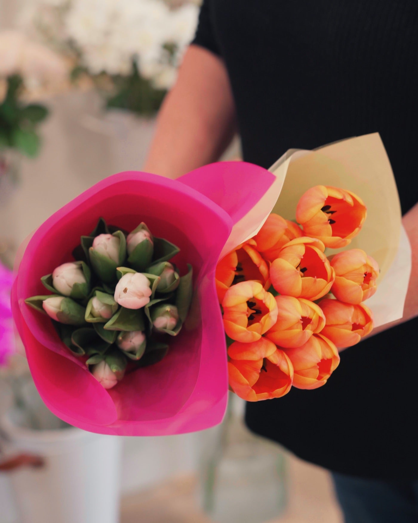 Lisa holding two bouquets at The Blu Tulip